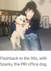 Elena and Sparky, caption reads "Flashback to the 90s, with Sparky, the PRI office dog."